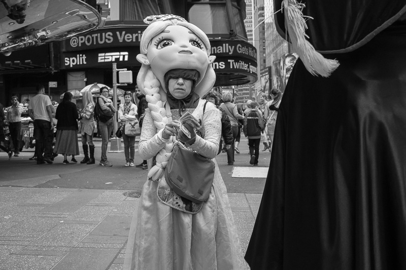 Princess in Times Square counting his cash.