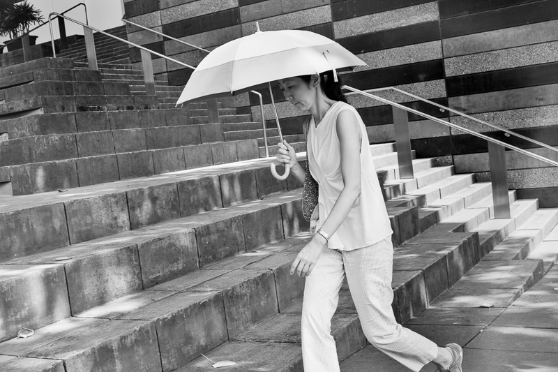 Woman with umbrella, School of the Arts, Bras Basah Road