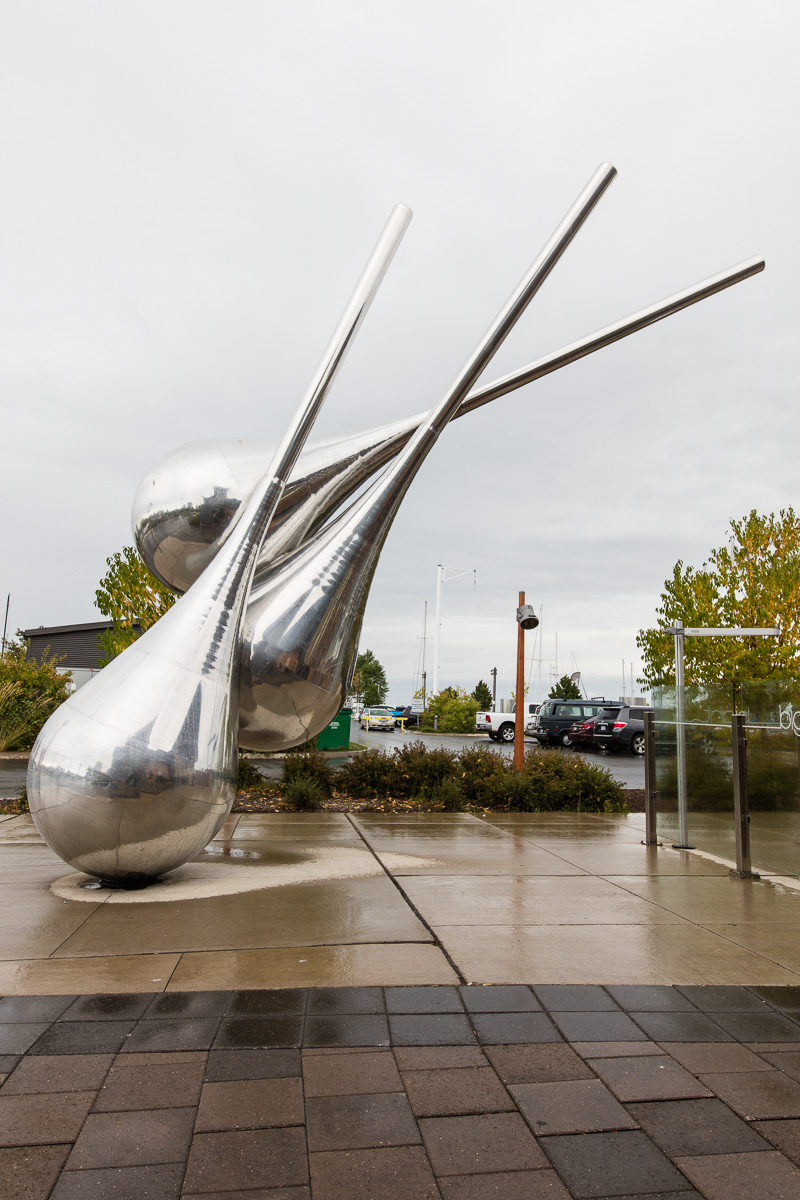 Part of a sculpture (these three point to another metal glob - the traveller? - out of the photo's frame) in front of Bight Restaurant on Thunder Bay's waterfront.