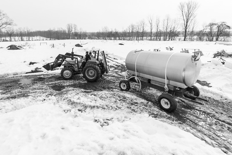 Delivering a tank full of sap to the barn.