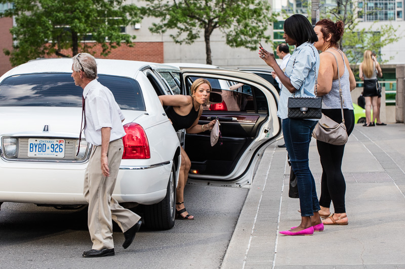 A serious Beyoncé fan gets out of her limo.