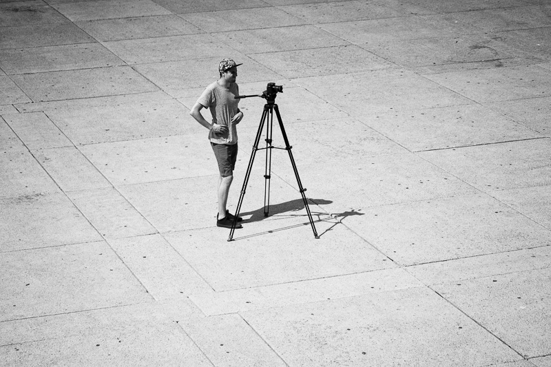 Photographer with tripod in Nathan Phillips Square