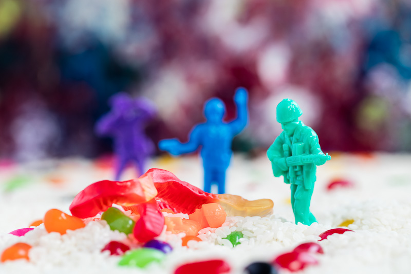 Soldiers confront gummy worms in a field of rice and jelly beans