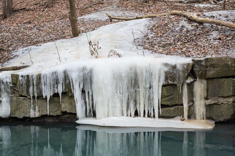 Ice flowing over retaining wall