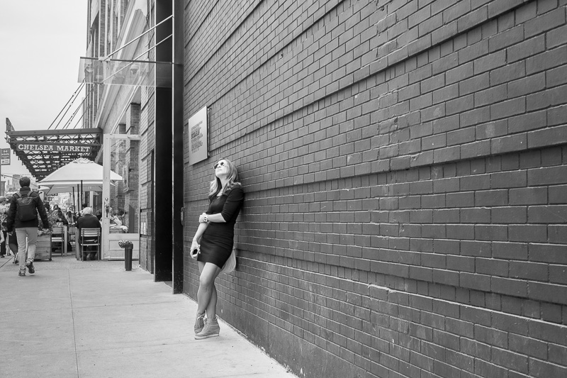 Leaning against the wall at Chelsea Market.