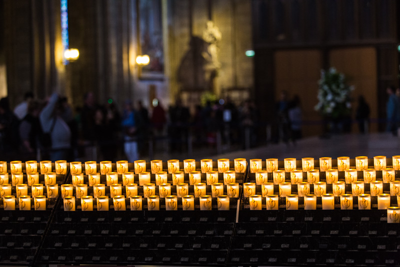 Lighted candles in the Cathédrale Notre-Dame de Paris