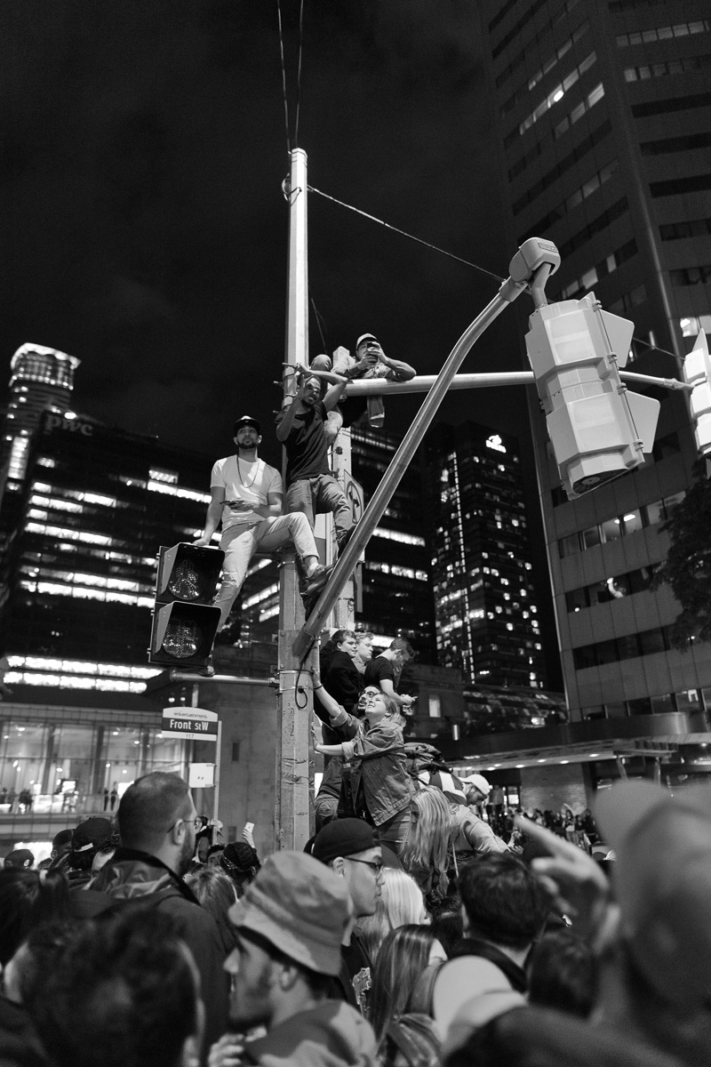 Climbing street lights and Front and York Streets, Toronto