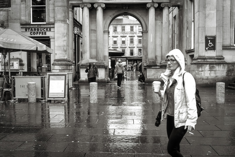 Woman Smoking In Rain, Looking Down Exchange Place to Buchanan St.