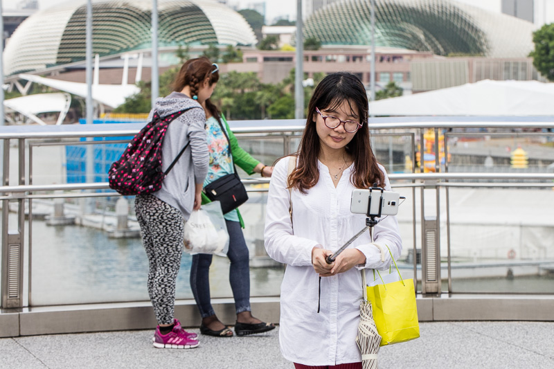 Girl takes selfie from Singapore's Double Helix bridge