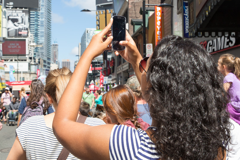 Woman takes photo with cracked cell phone