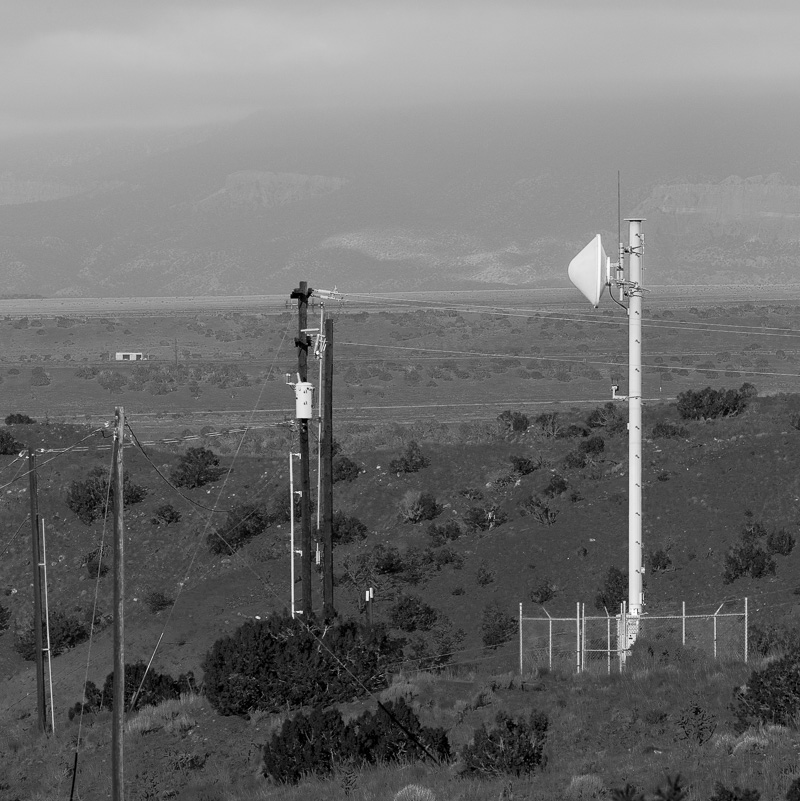 The scenery at Ghost Ranch, including utility poles and cell tower