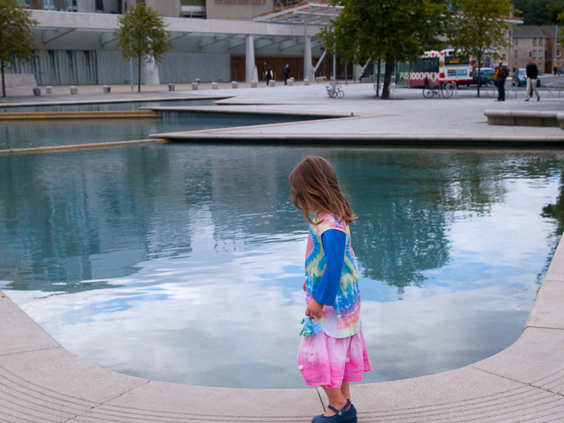 Girl in front of the Scottish Parliament