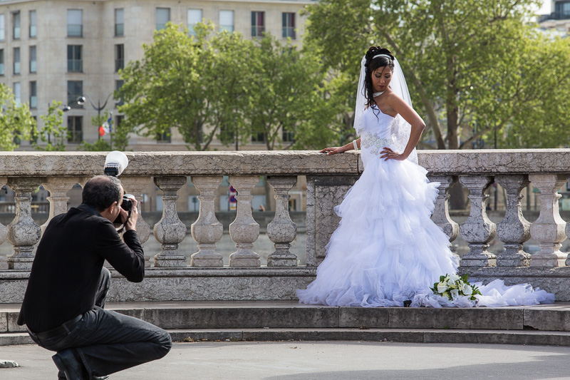 Bride being photographed on the Pont Alexandre III