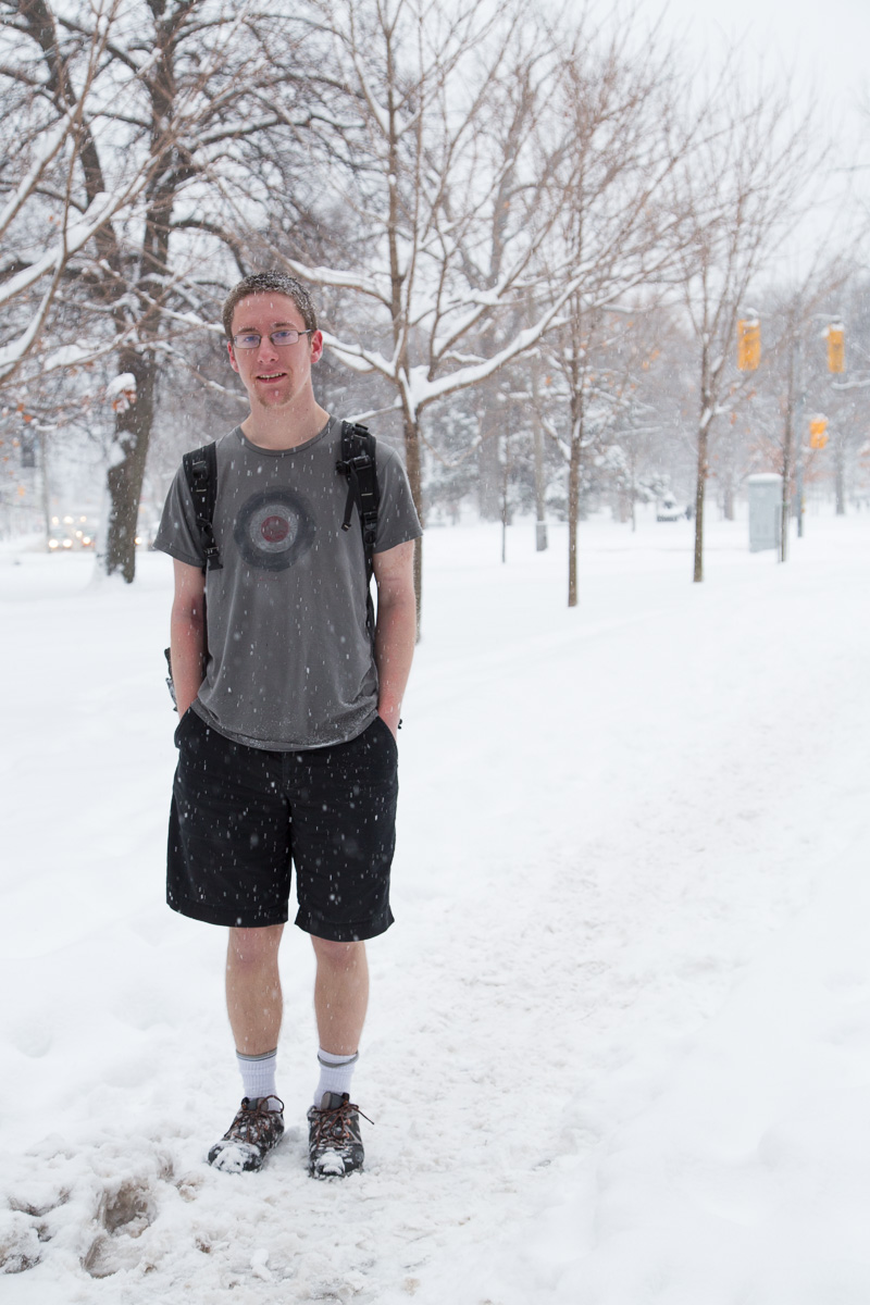 Student in shorts during snowstorm