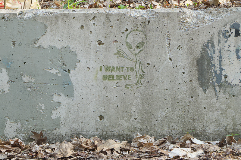 I Want To Believe - stencil of alien on concrete