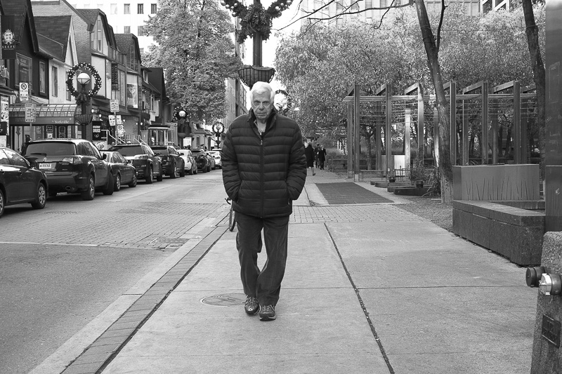 Man walking on sidewalk