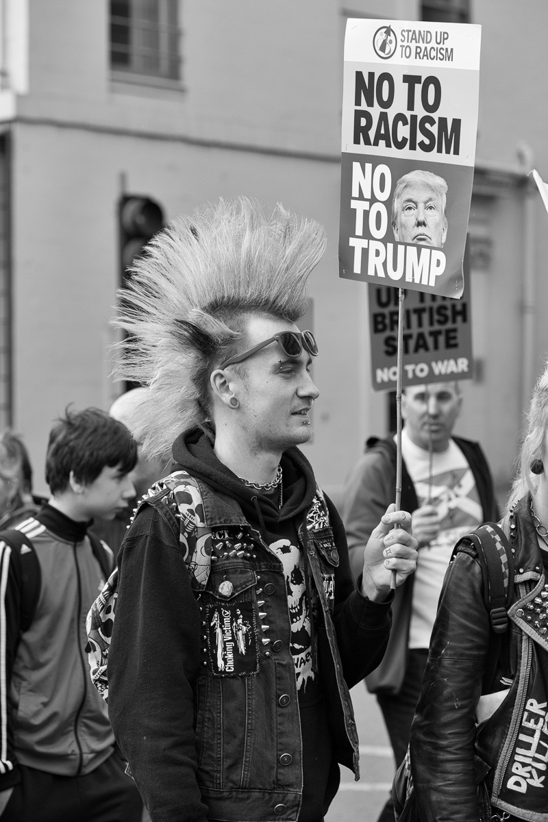 Marcher with a mohawk at the All Under One Banner (AUOB) march in Glasgow