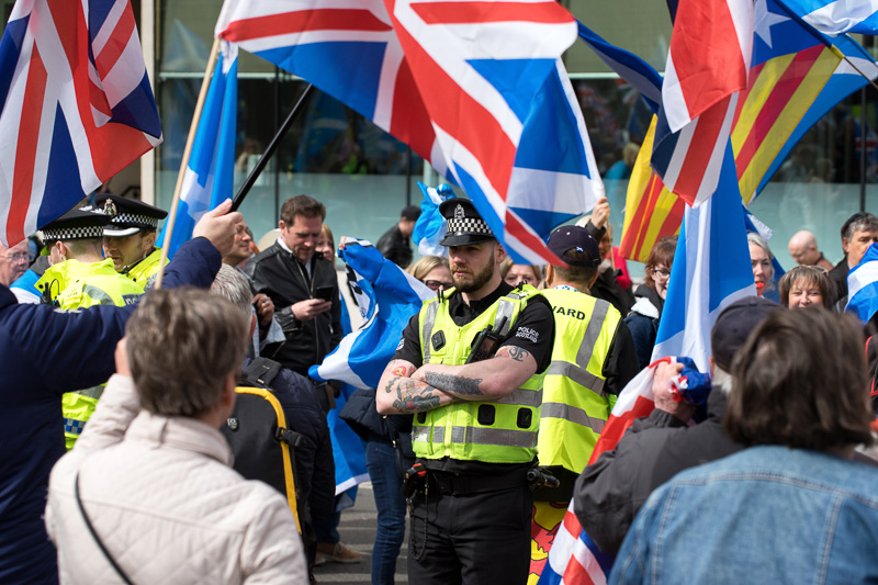 Police look on at the All Under One Banner (AUOB) march in Glasgow