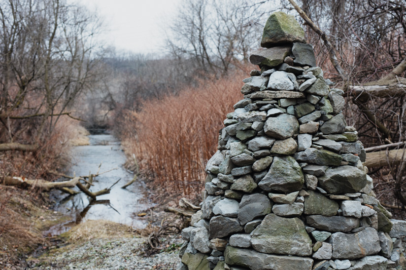 Cairn overlooking millrace alongside the Lower Don Trail in Toronto.