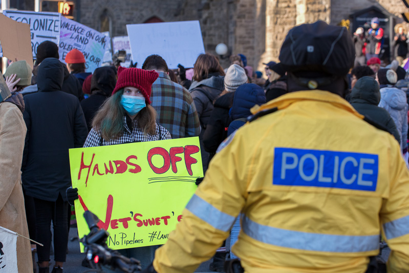 Hands Off: protester sign during march in solidarity with the Wet'suwet'en First Nation, Bloor Street, Toronto