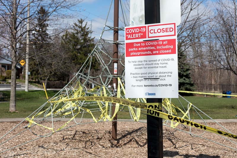 Playground taped off with Covid-19 Alert sign
