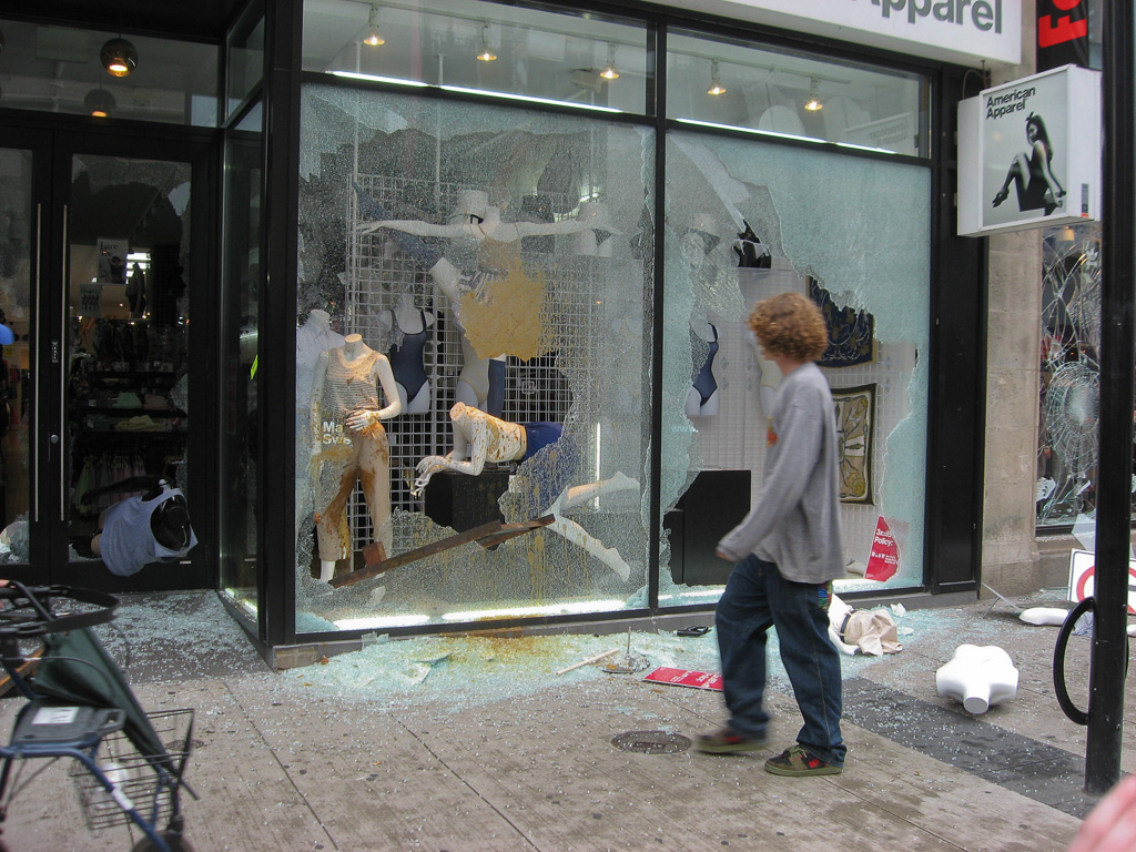 American Apparel store window is smashed and mannequins covered in shit. Toronto G20 Summit, June 26, 2010.