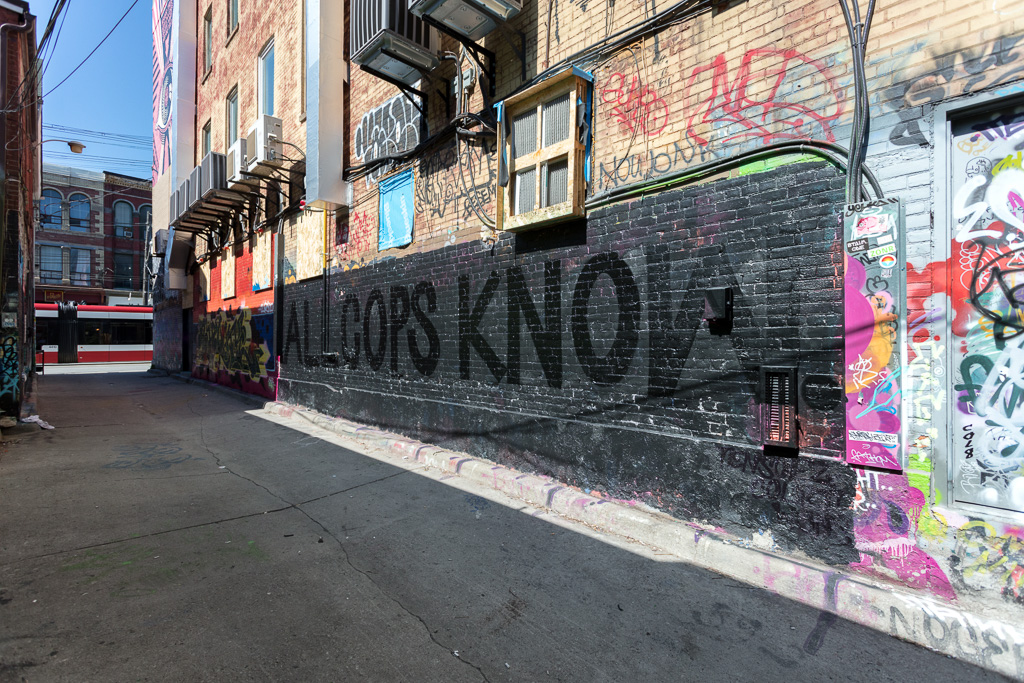 All Cops Know - part of the Paint The City Black initiative in Toronto's Graffiti Alley