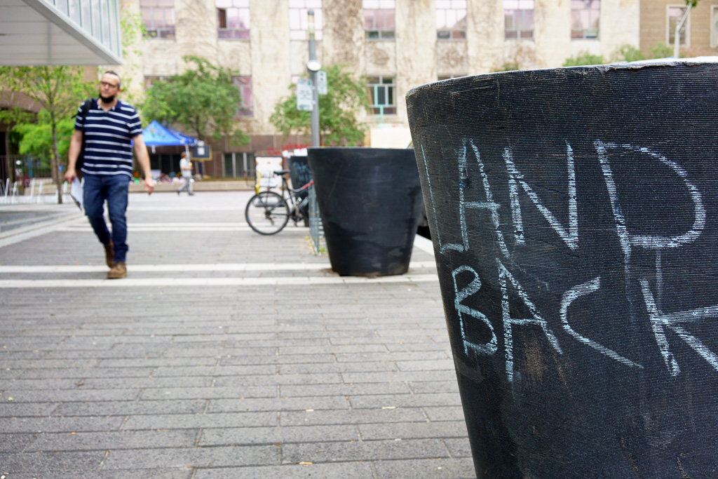 Chalk message on Ryerson campus, Toronto: Land Back.