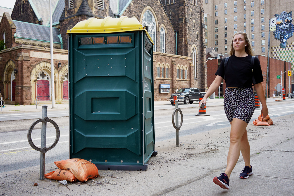 Portable toilet in front of Bloor Street United Church, Toronto