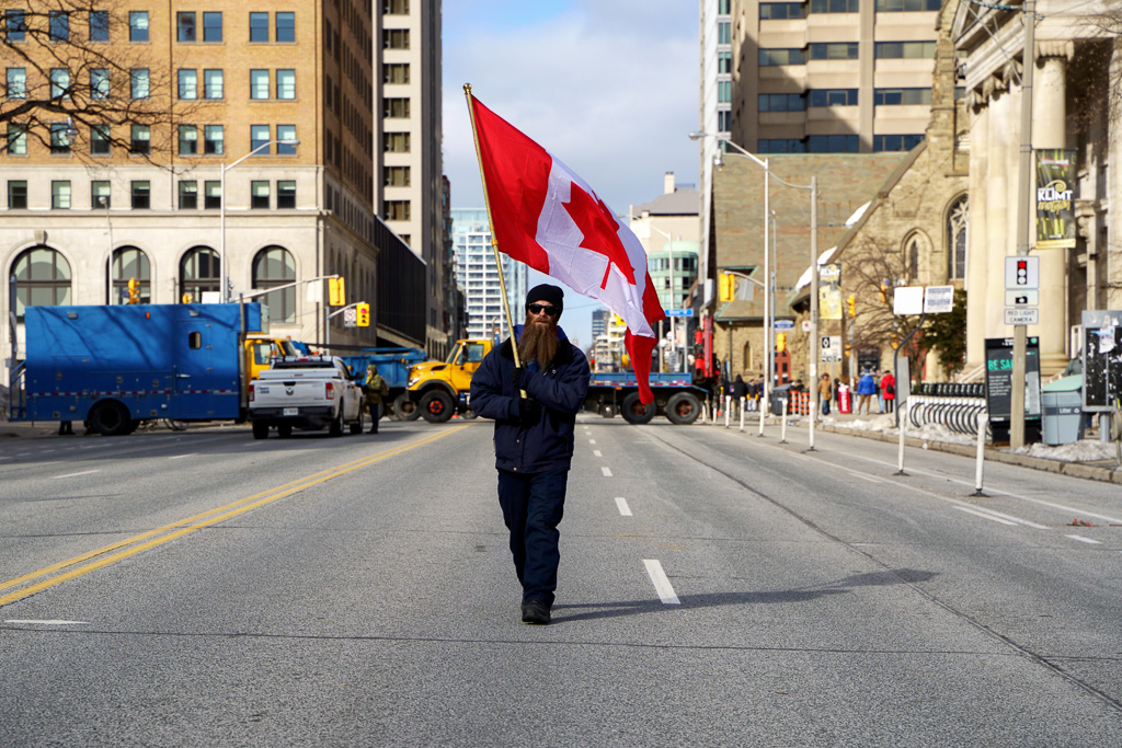 Protester Carries Canadian Flag, Avenue Road, Toronto
