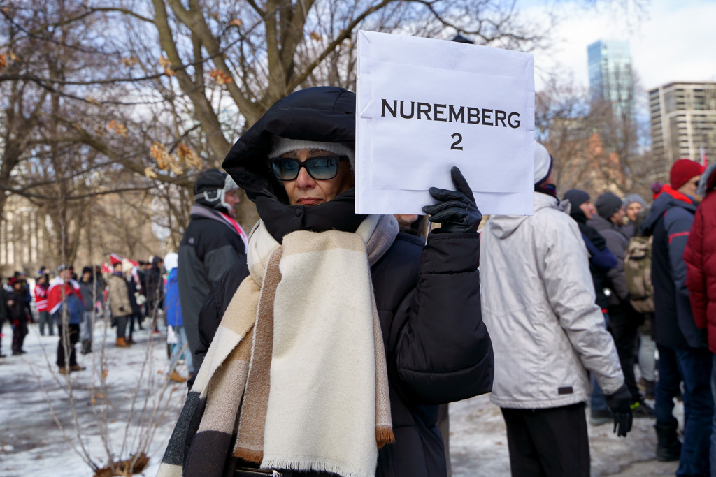 Protester at Anti-Vaxx Rally carries sign that says "Nuremberg 2"