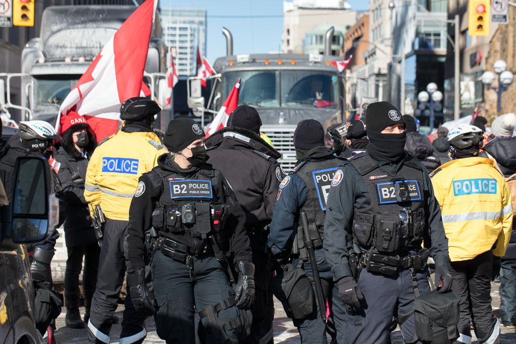 Trucks meet police at Bloor Street and Avenue Road, Toronto