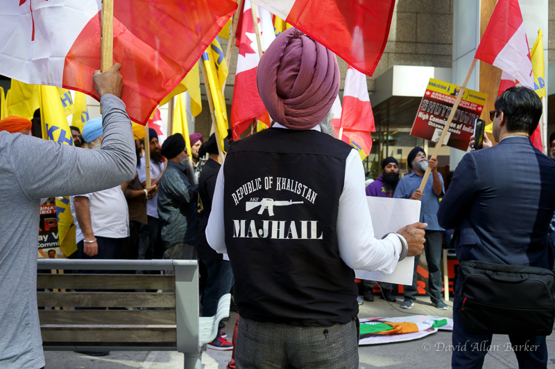 A Sikh protester outside the Indian Consulate in Toronto wears a vest with the words "Republic of Khalistan" an image of an automatic weapon and, underneath it, the word "Majhail".